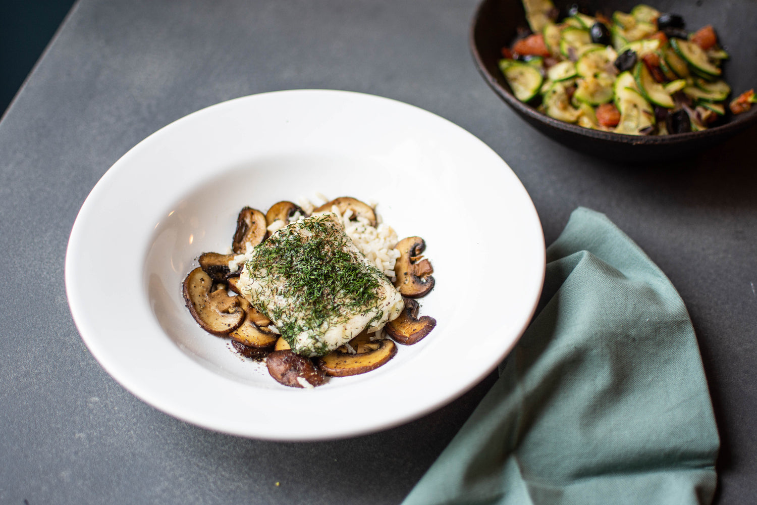 Courgette ratatouille met kabeljauw uit de oven